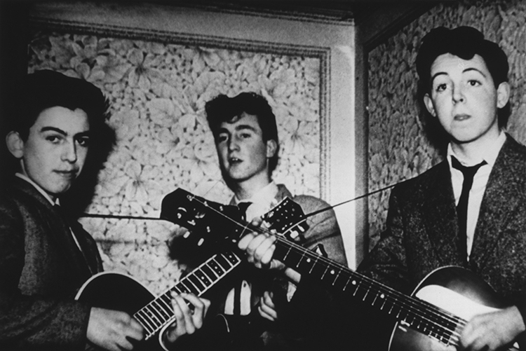 Photo: Akg Images. Quarrymen days. (Right to Left) Paul, John and an absurdly young looking George play at a family party