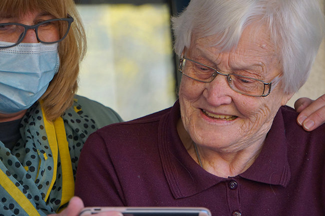 Senior woman receiving personal care from Right at Home franchise caregiver