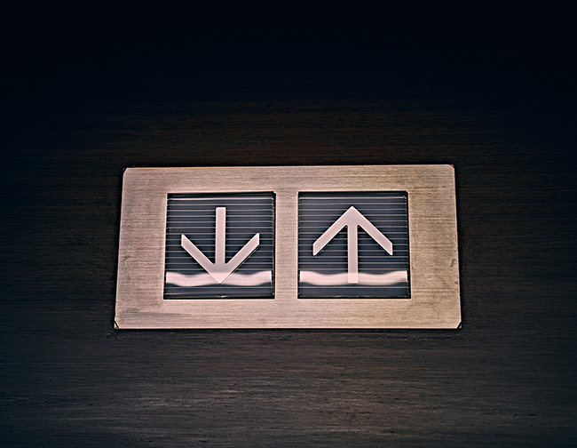 Elevator up and down buttons symbolizing residential elevators for seniors