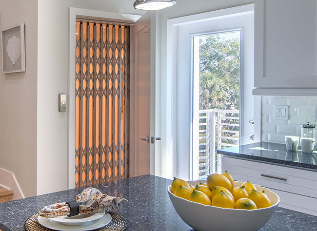 Classic residential elevator for seniors with timeless flat wall design and customizable wood finishes
