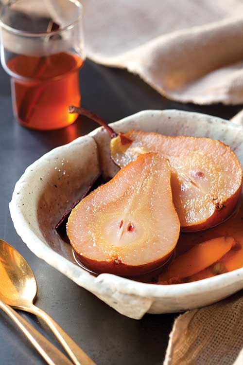 Chai-poached pears with warm spices served for dessert