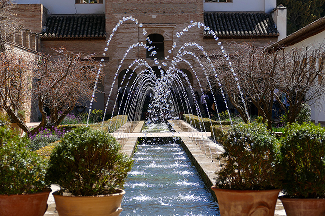 Fountains and water channels in the gardens of the Alhambra palace in Granada, Spain.
