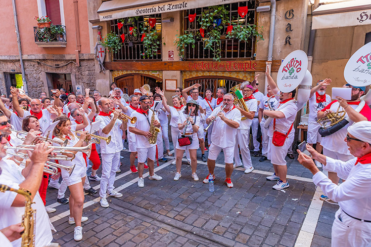 Musicians and festival-goers celebrating San Fermín in Pamplona, Spain