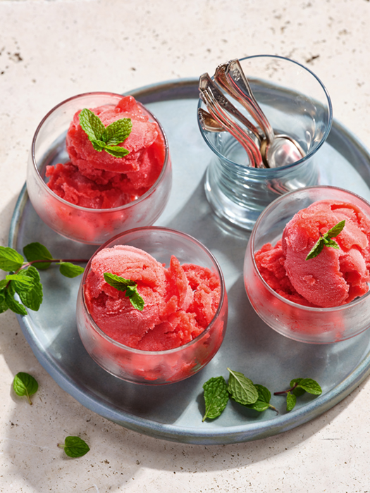 Strawberry-mint sorbet served in glass bowls with fresh mint