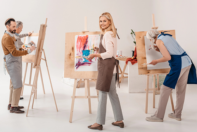 Adults exploring their creativity in a painting class