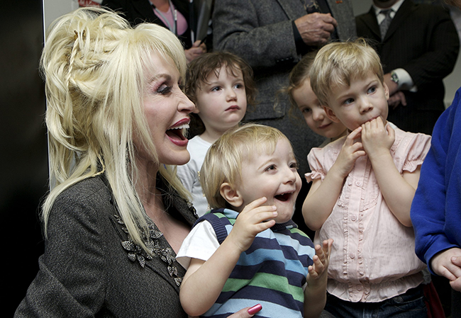 Dolly Parton with young children at an Imagination Library event
