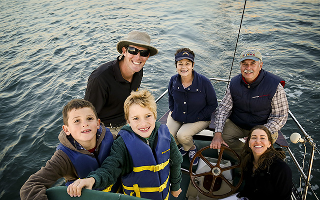 Multigenerational family enjoying a boating getaway in San Diego